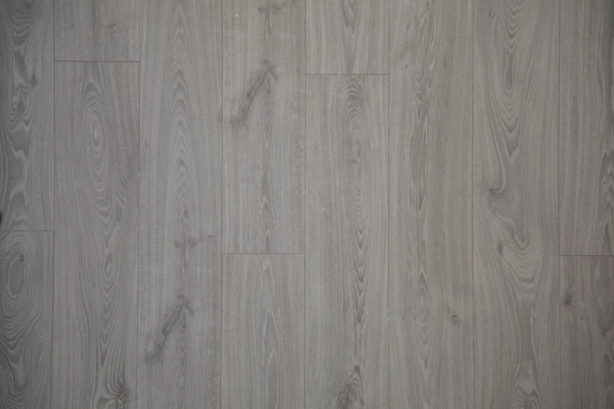 Top view of gray wood-look planks laid in rows with the short joints staggered